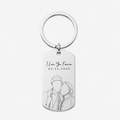 A silver metal dog tag keychain with a circular split ring, featuring engraved text reading 'I Love You Forever' and the date '02.11.