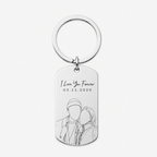 A silver metal dog tag keychain with a circular split ring, featuring engraved text reading 'I Love You Forever' and the date '02.11.